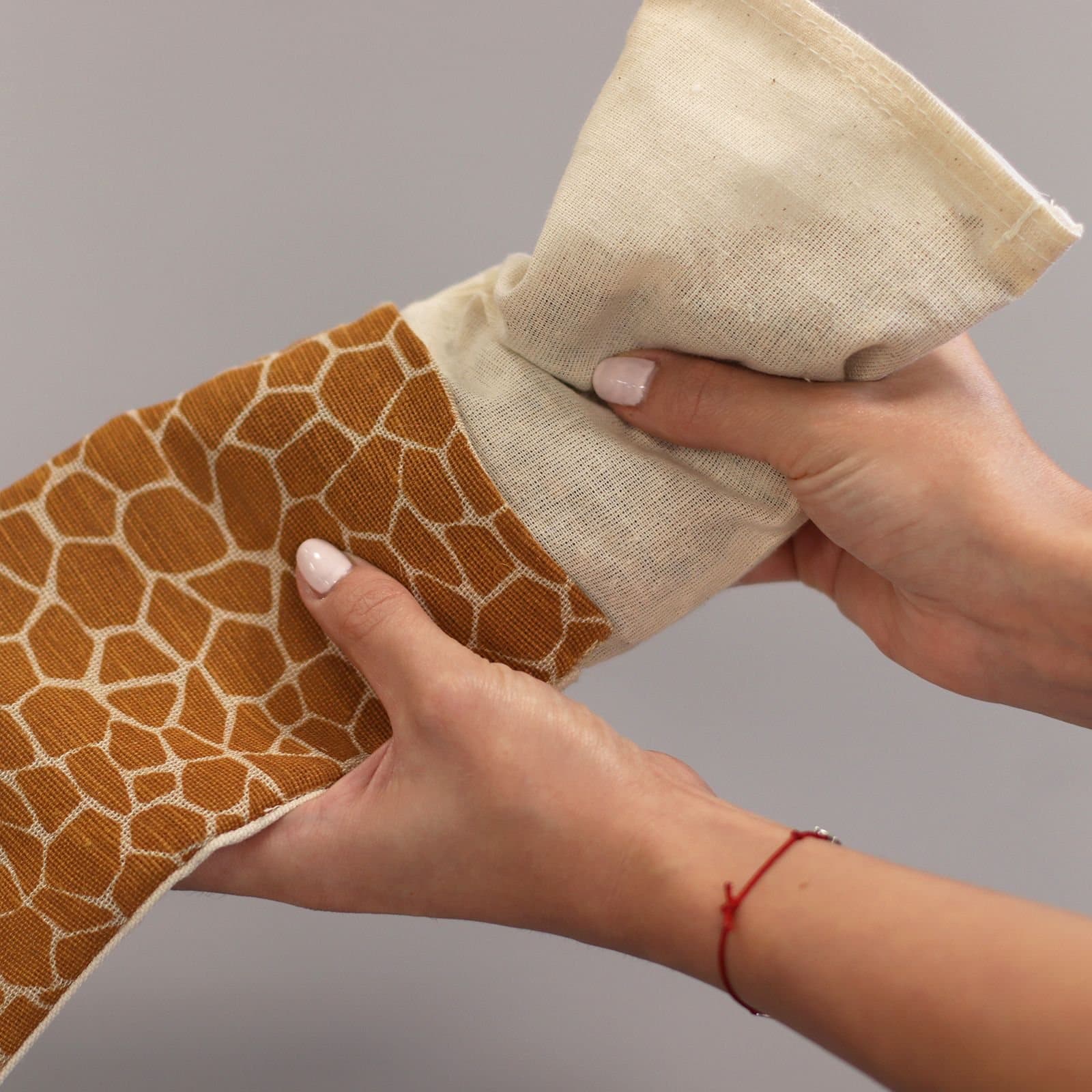 Lavender cotton eye pillow with a Madagascar Giraffe design