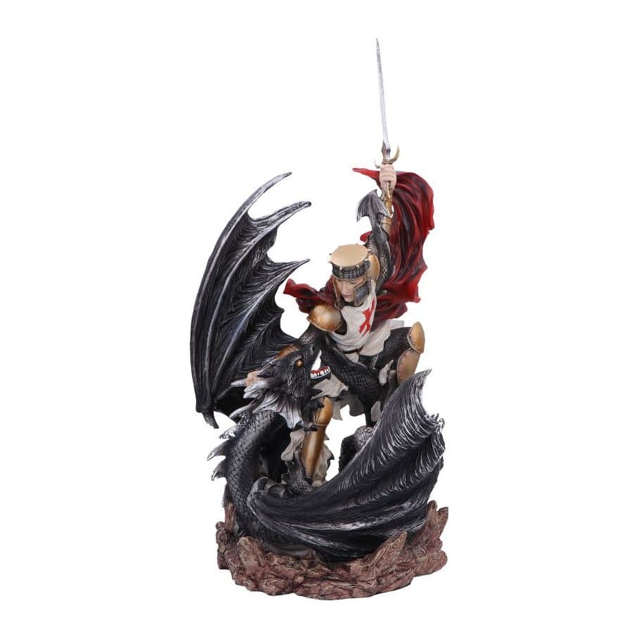 Knight in golden armour defeating a black dragon, a resin figurine on a rocky base