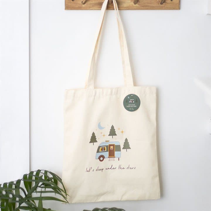 Polycotton tote bag with a caravan design and 'Let's sleep under the stars' text