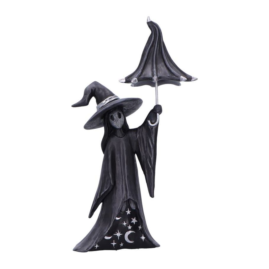 Black witch figurine in robes holding a crooked umbrella