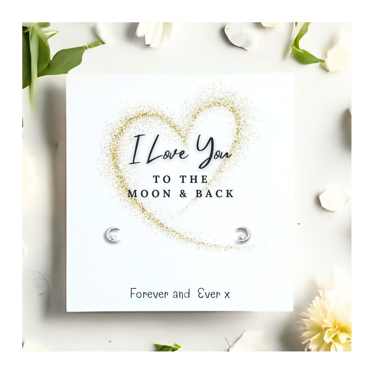 Sterling silver moon and star stud earrings with a Love You To The Moon & Back card
