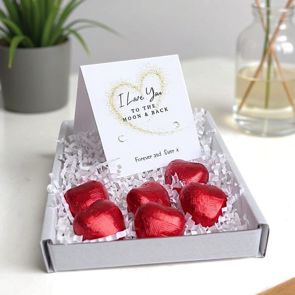 Mini gift hamper with silver stud earrings and red foiled milk chocolate hearts