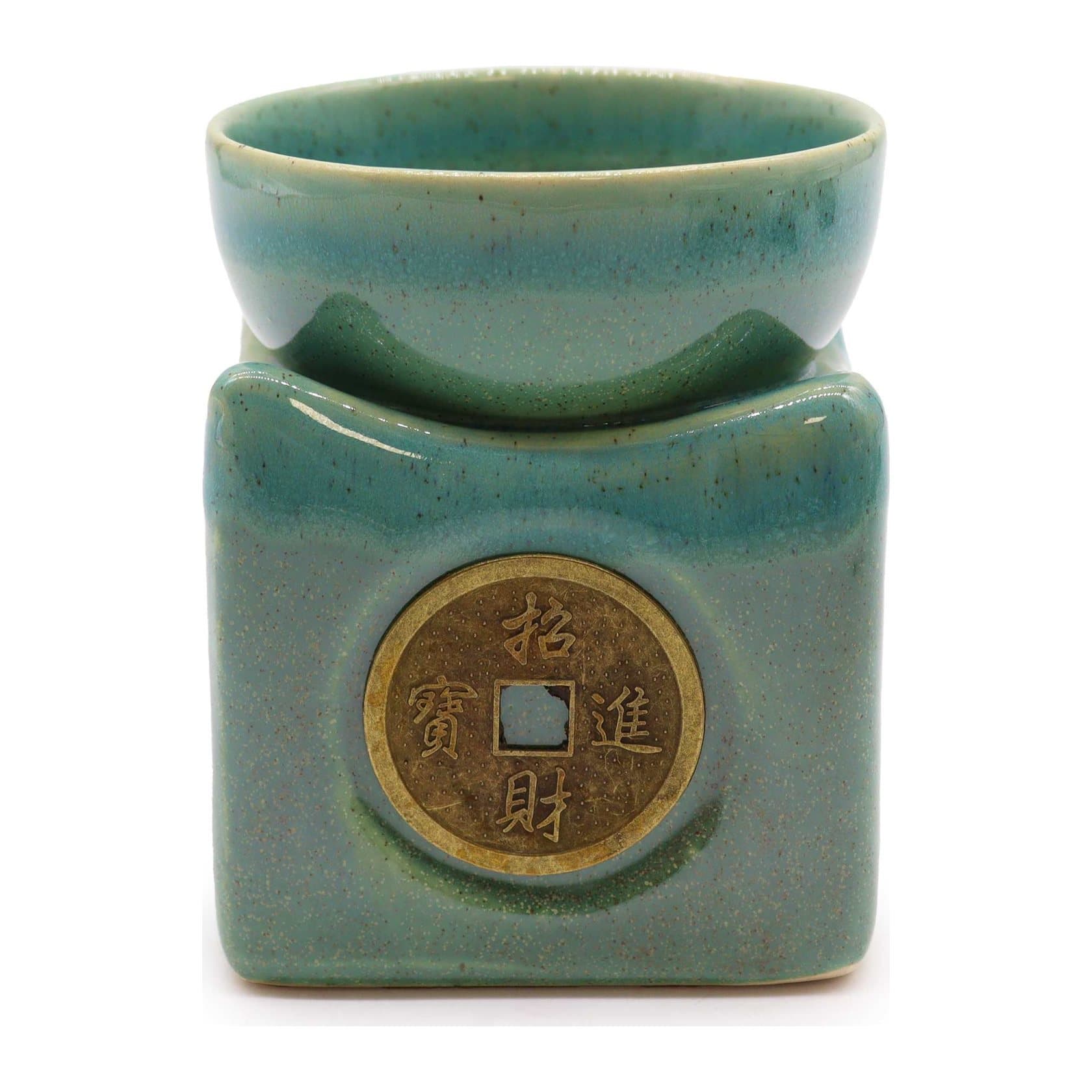 Large jade lucky coin oil burner with an intricate coin motif
