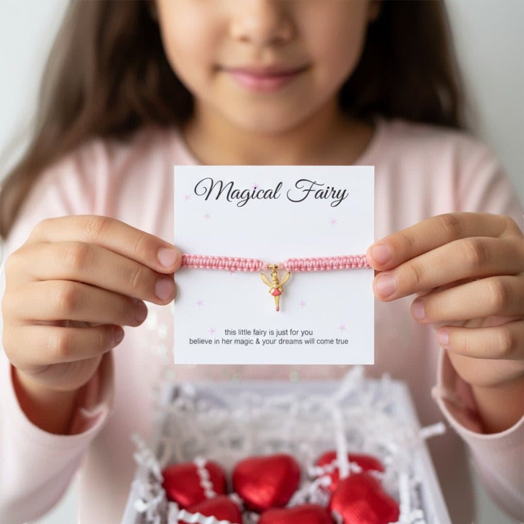 Pink friendship bracelet with a fairy charm and red foiled milk chocolate hearts