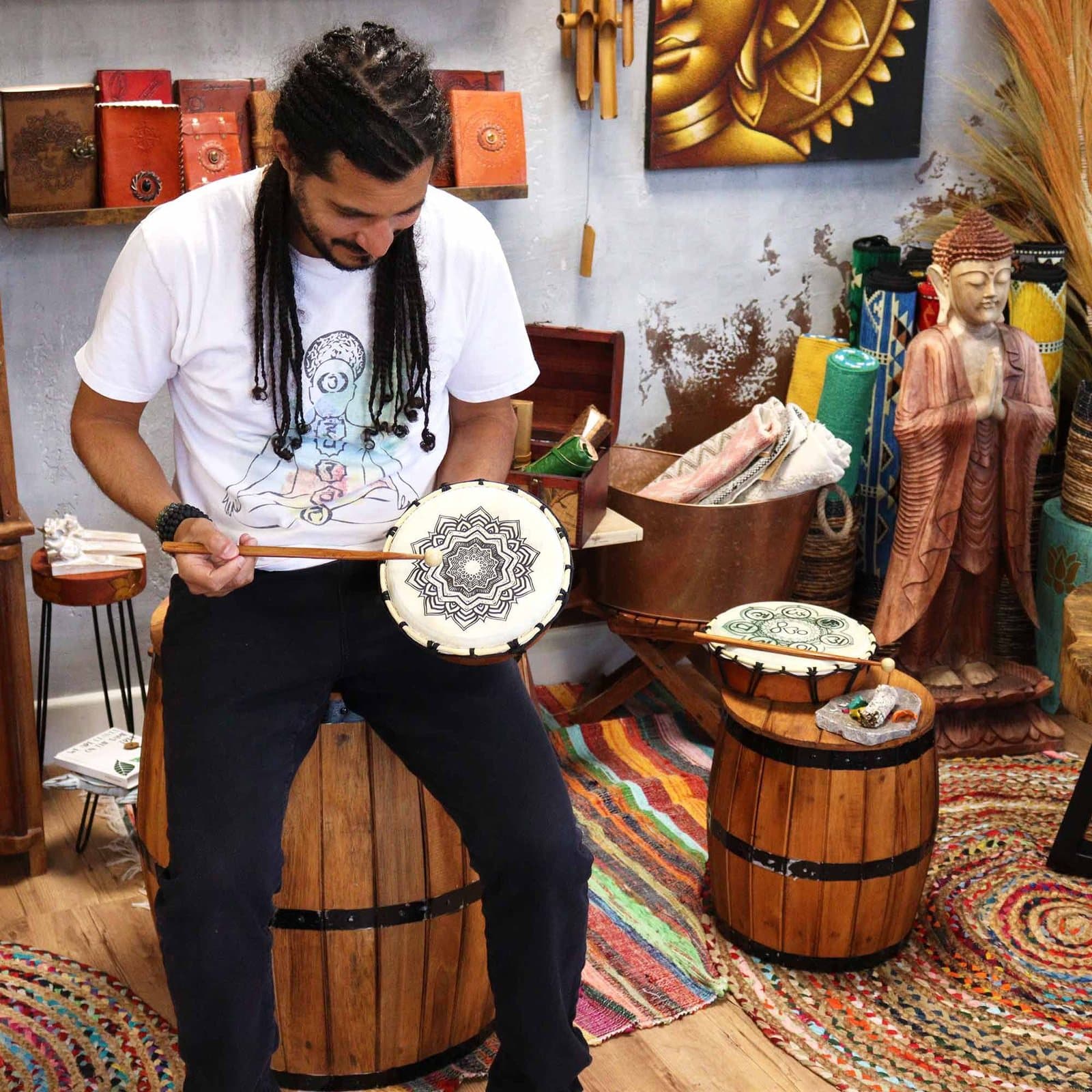 Mandala shamanic drum with detailed mandala artwork and a wooden beater