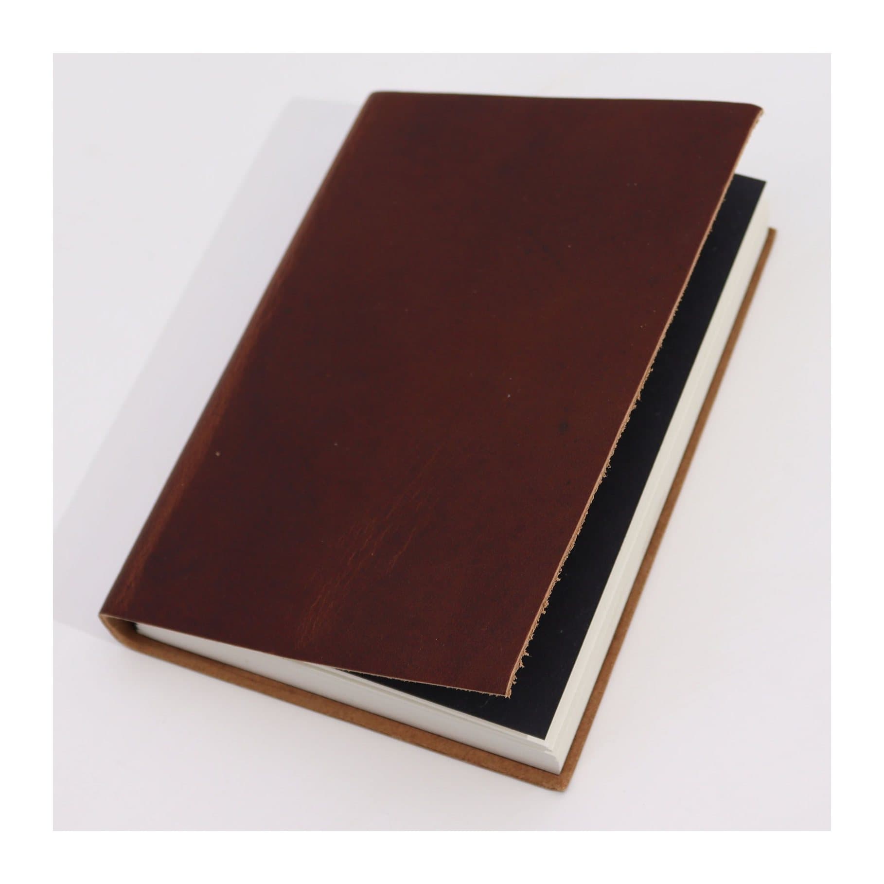 Medium dark tan leather daily notebook with lined pages