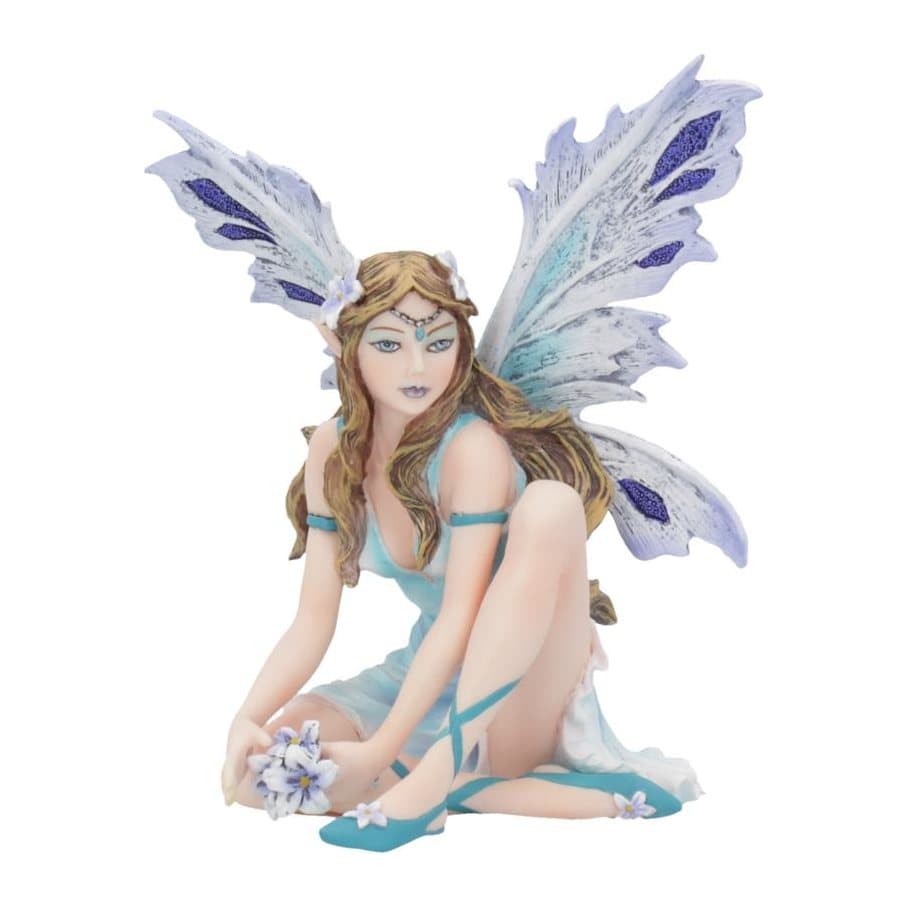 Pastel resin fairy figurine sitting with white wings spread behind her
