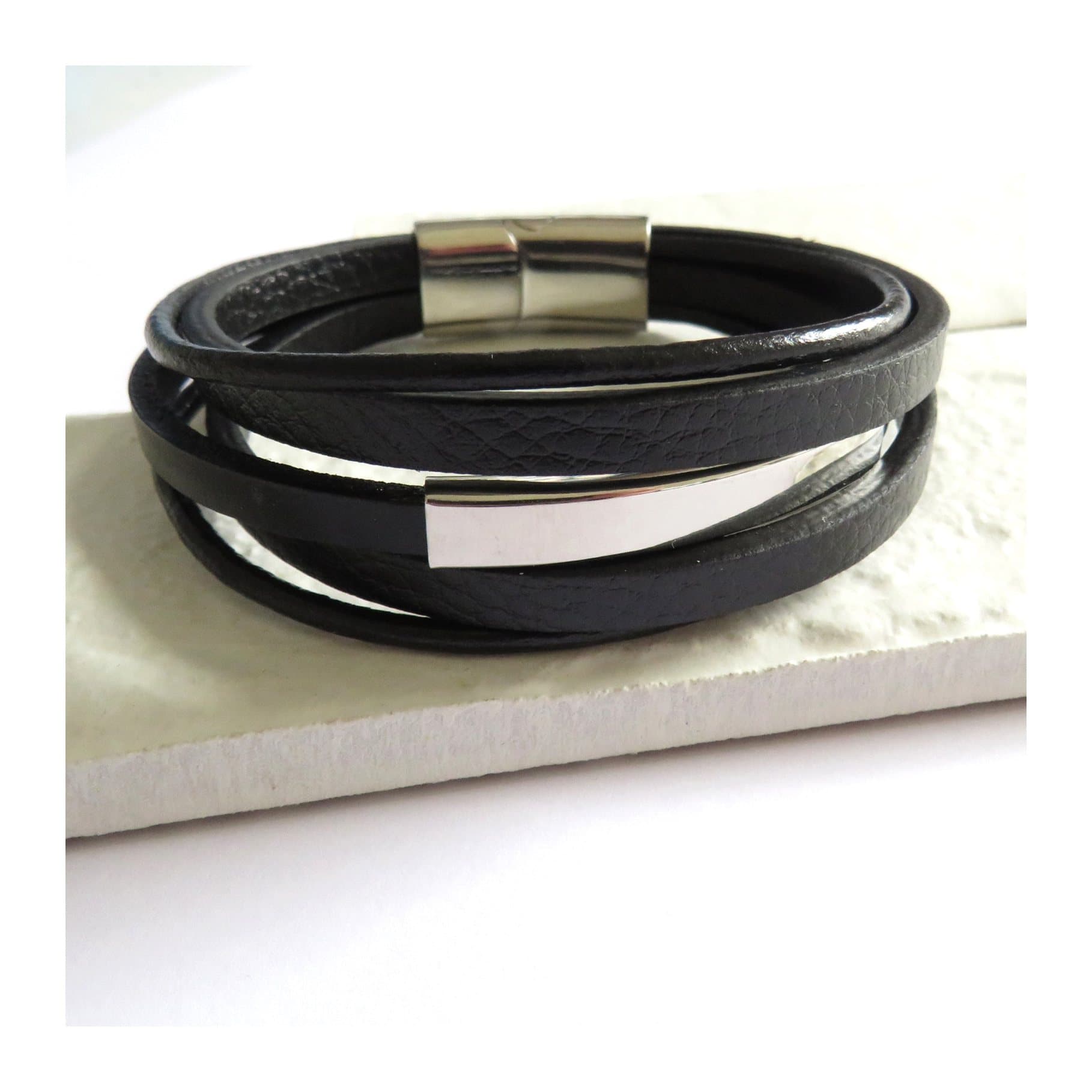 Men's black multi strand leather bracelet with a stainless steel bar