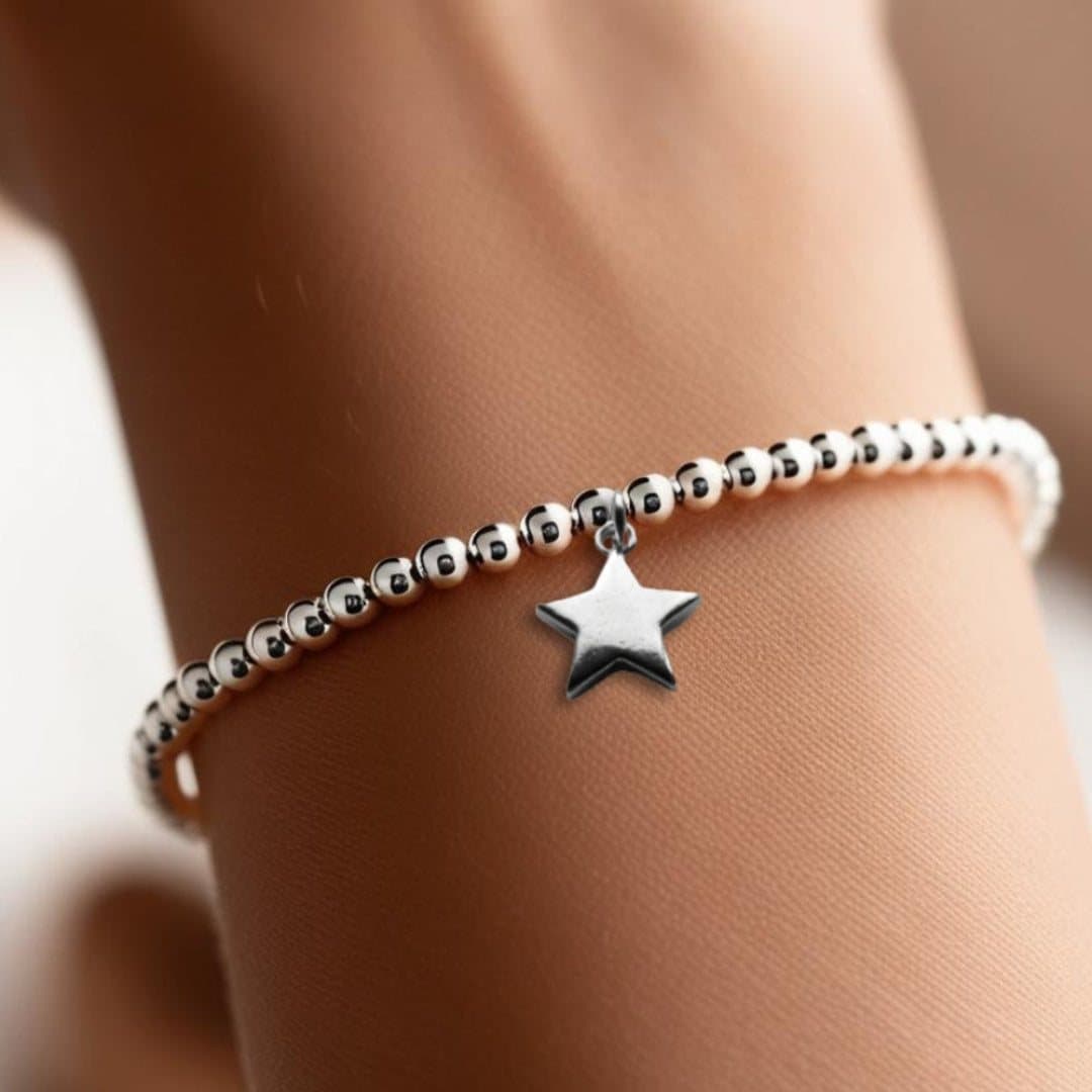 Christmas gift box with a silver star bracelet and milk chocolate hearts
