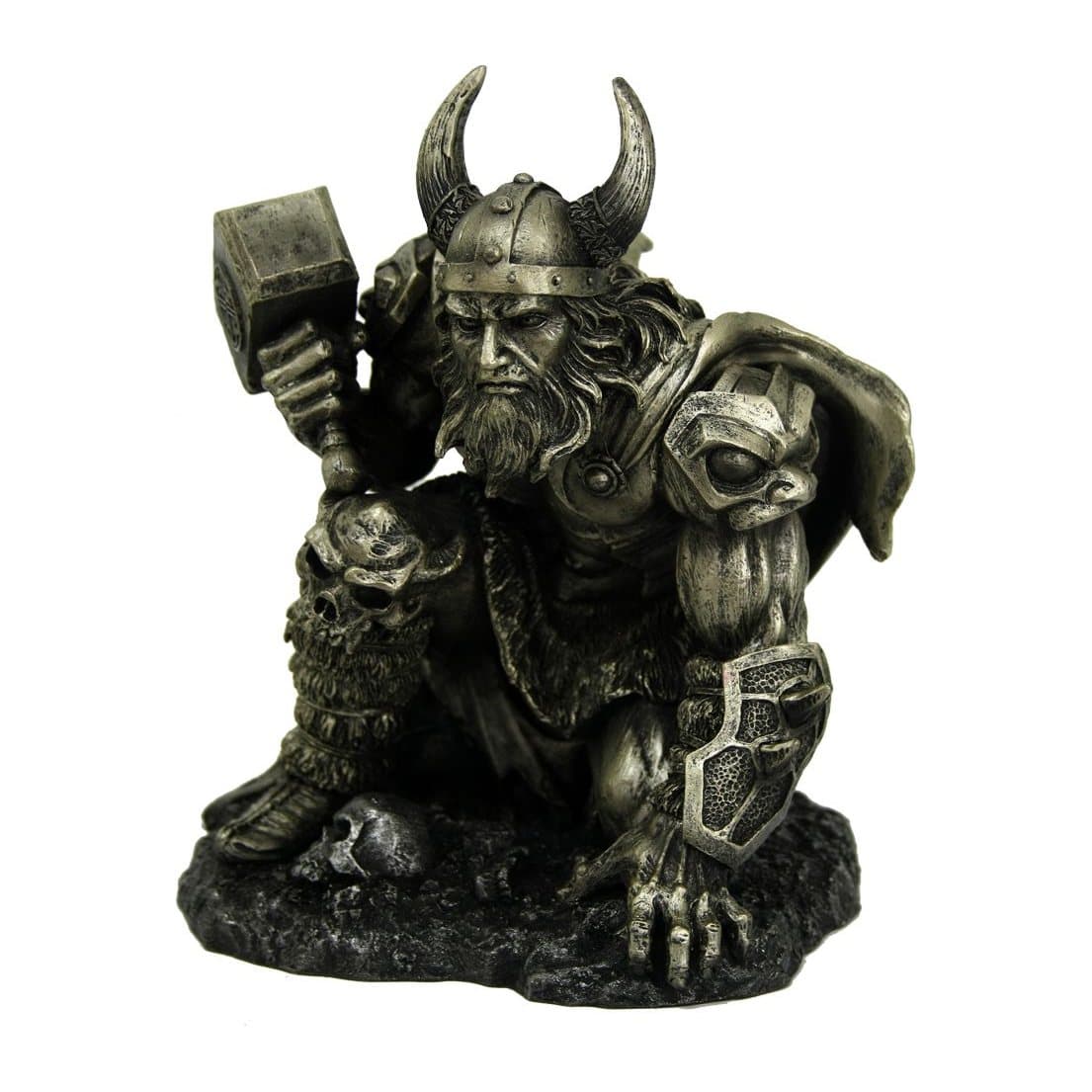Thor figurine rising from rocky ground, clasping his hammer Mjolnir