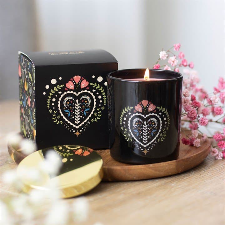 Black glass candle jar with a folk heart design