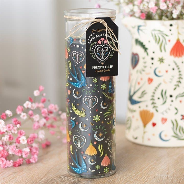 Tall tube candle wrapped in a black floral print