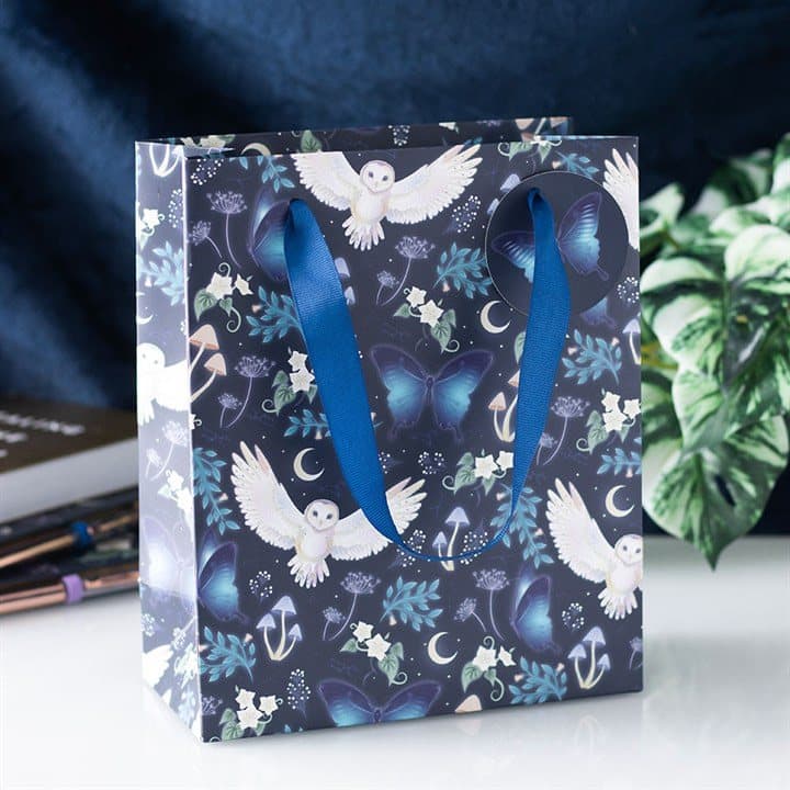 Medium paper gift bag printed with night owls, moths, moons and forest plants