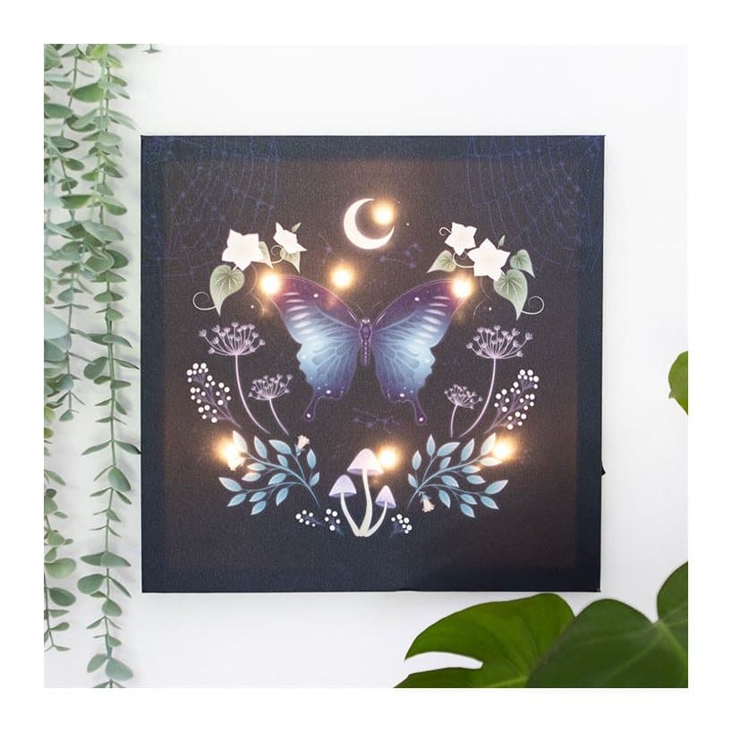 Light up wall canvas with a mystical moth and plant design
