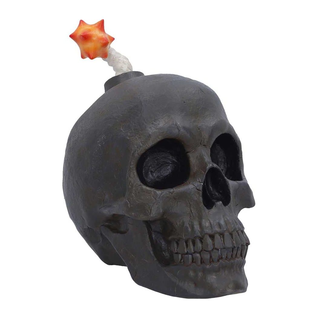Black resin skull figurine with a lit fuse on top, designed to look like a bomb