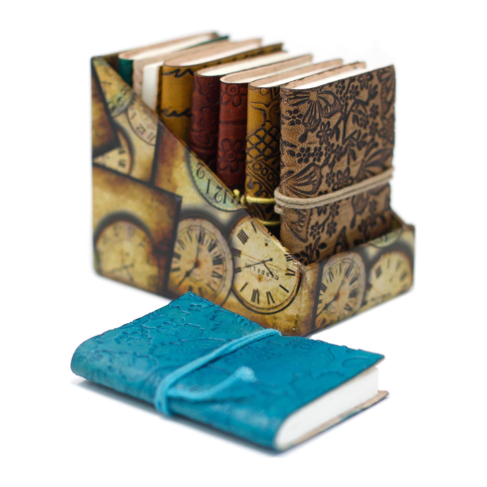 Pack of two mini leather notebooks with buckles, clasps and thongs on the covers.