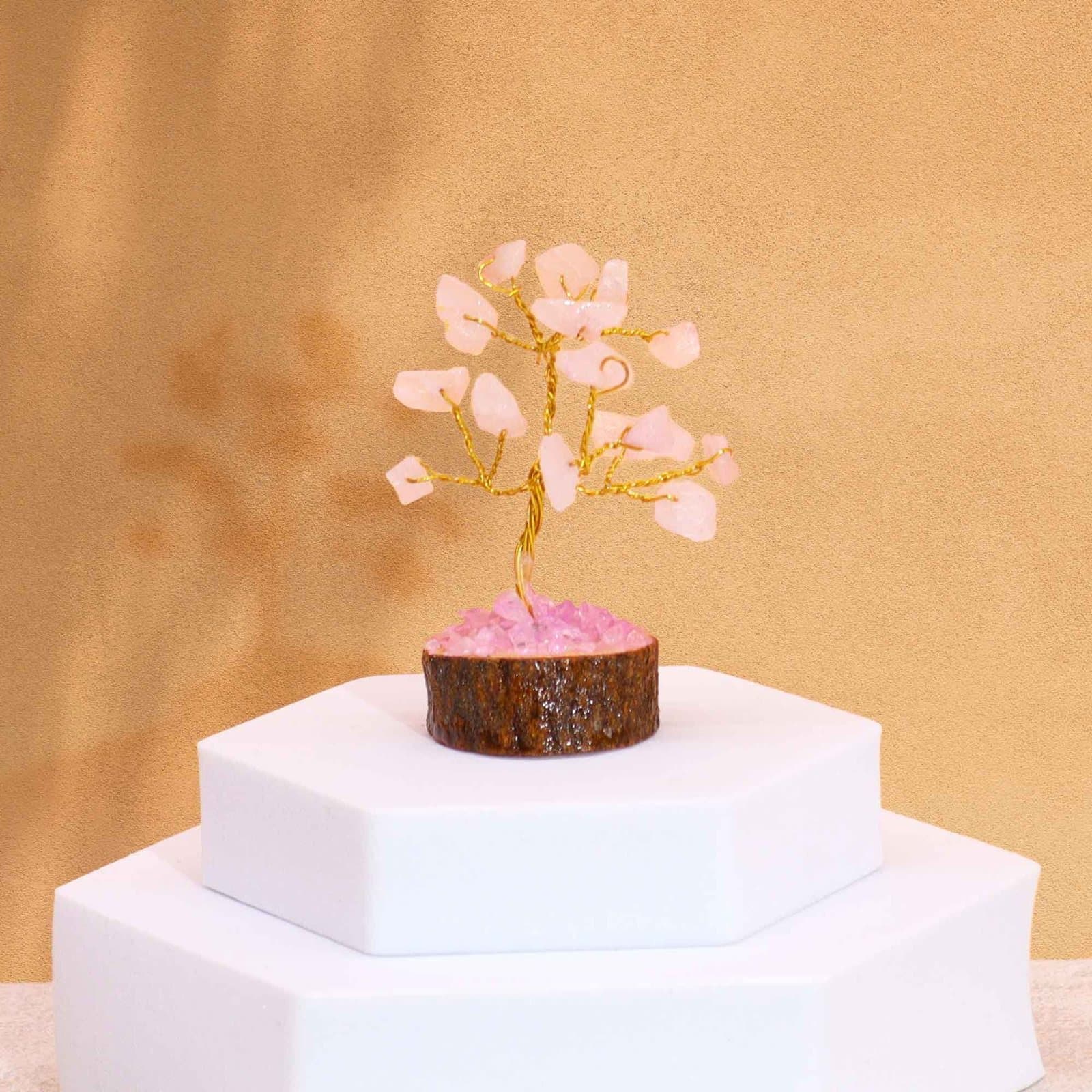 Mini gemstone tree on a wood base with rose quartz gemstones