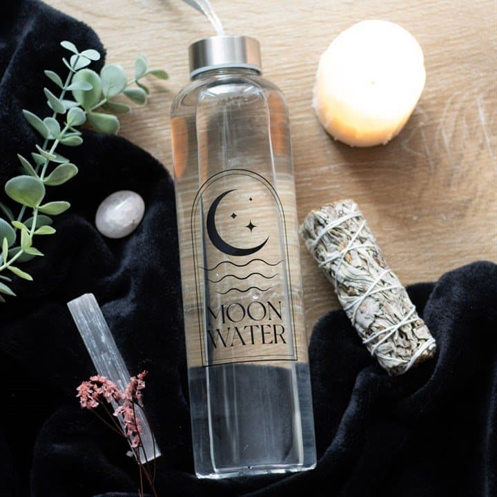 Glass moon water bottle with a white cardboard box