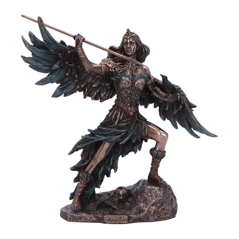 Morrigan figurine with raised leg on a rock, spear drawn back and a crow on her hand