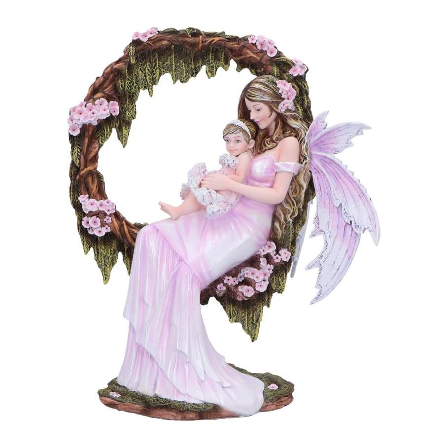 Pink fairy figurine cradling a baby among pink blossoms and moss-covered vines