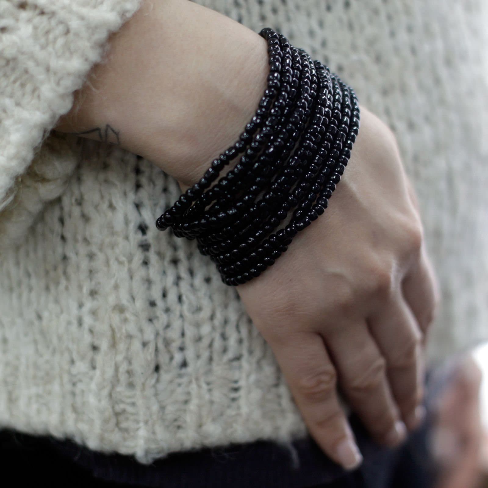 Multi-bead bangle bracelet with wooden clasp in assorted colours