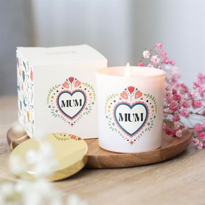 French tulip scented candle in a soft cream jar with a folk heart design