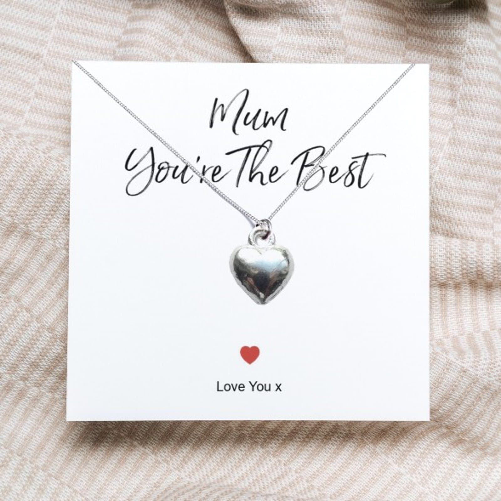 Silver heart pendant necklace on a Mum You're The Best message card