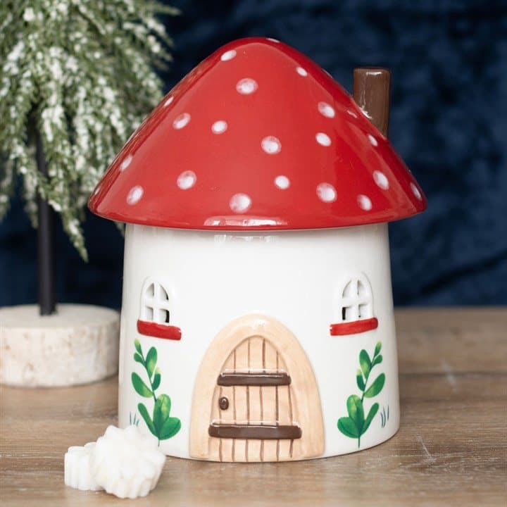 Dolomite mushroom house oil burner with a toadstool lid and glowing windows