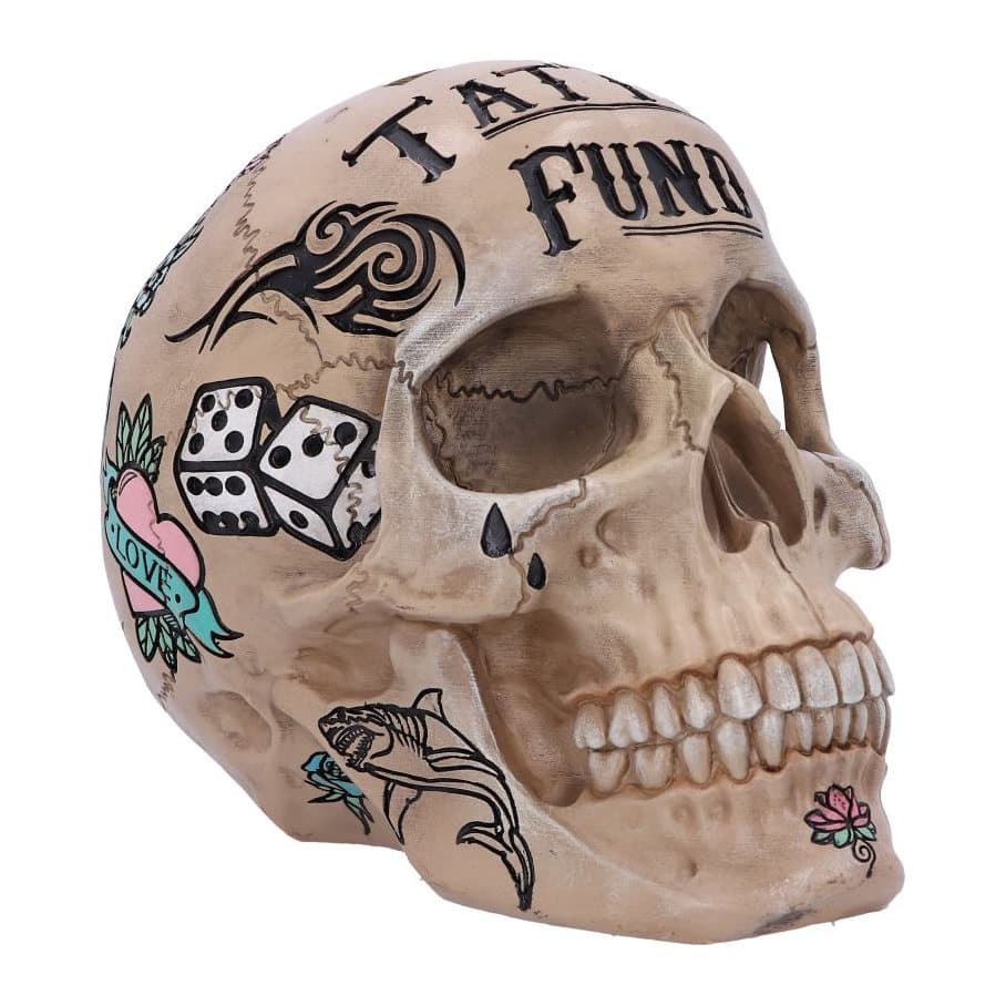 Natural bone coloured skull money box painted with tattoo designs