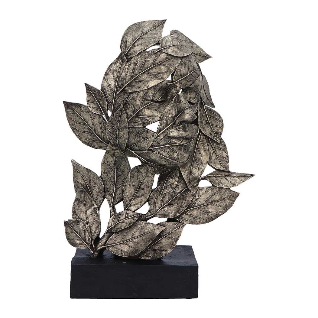 Silver resin statue of a woman with closed eyes and a head formed by leaves