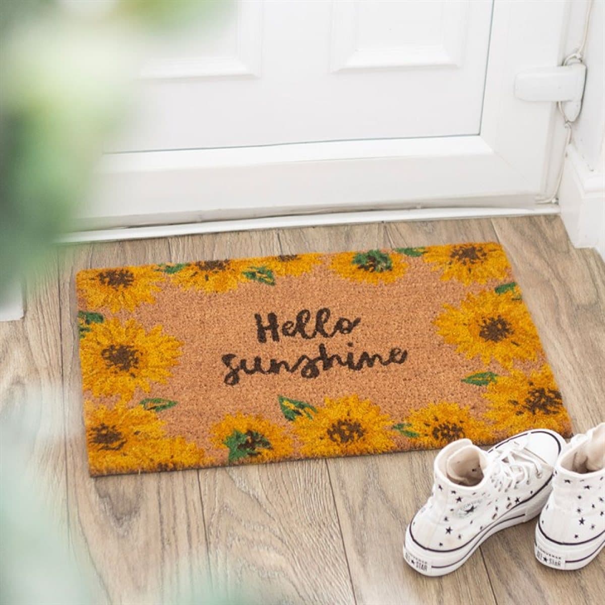 Doormat with Hello Sunshine text surrounded by sunflower illustrations