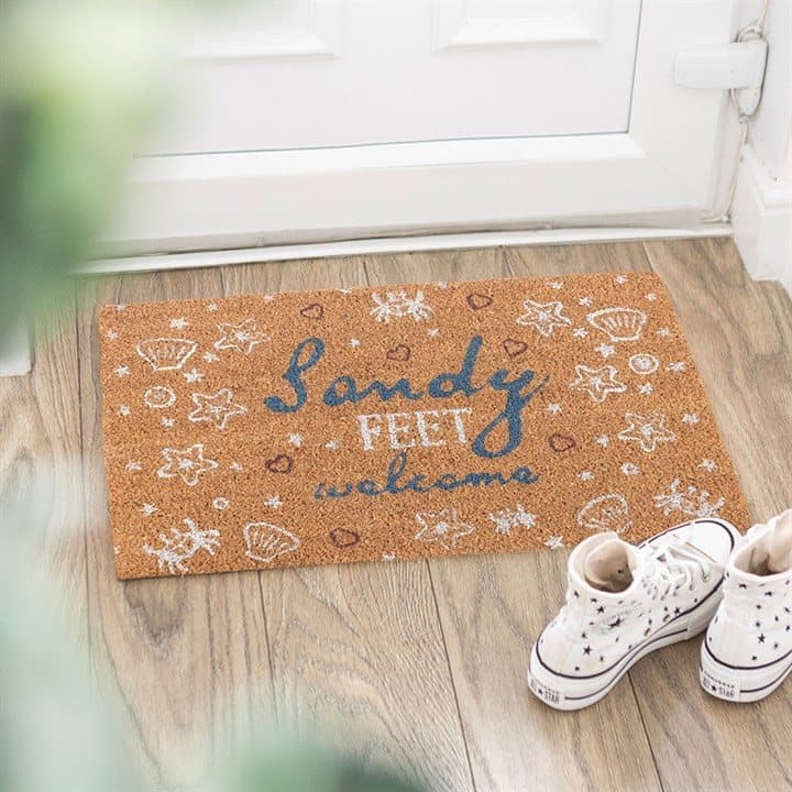 Natural coir doormat with Sandy feet welcome text, shells and crabs