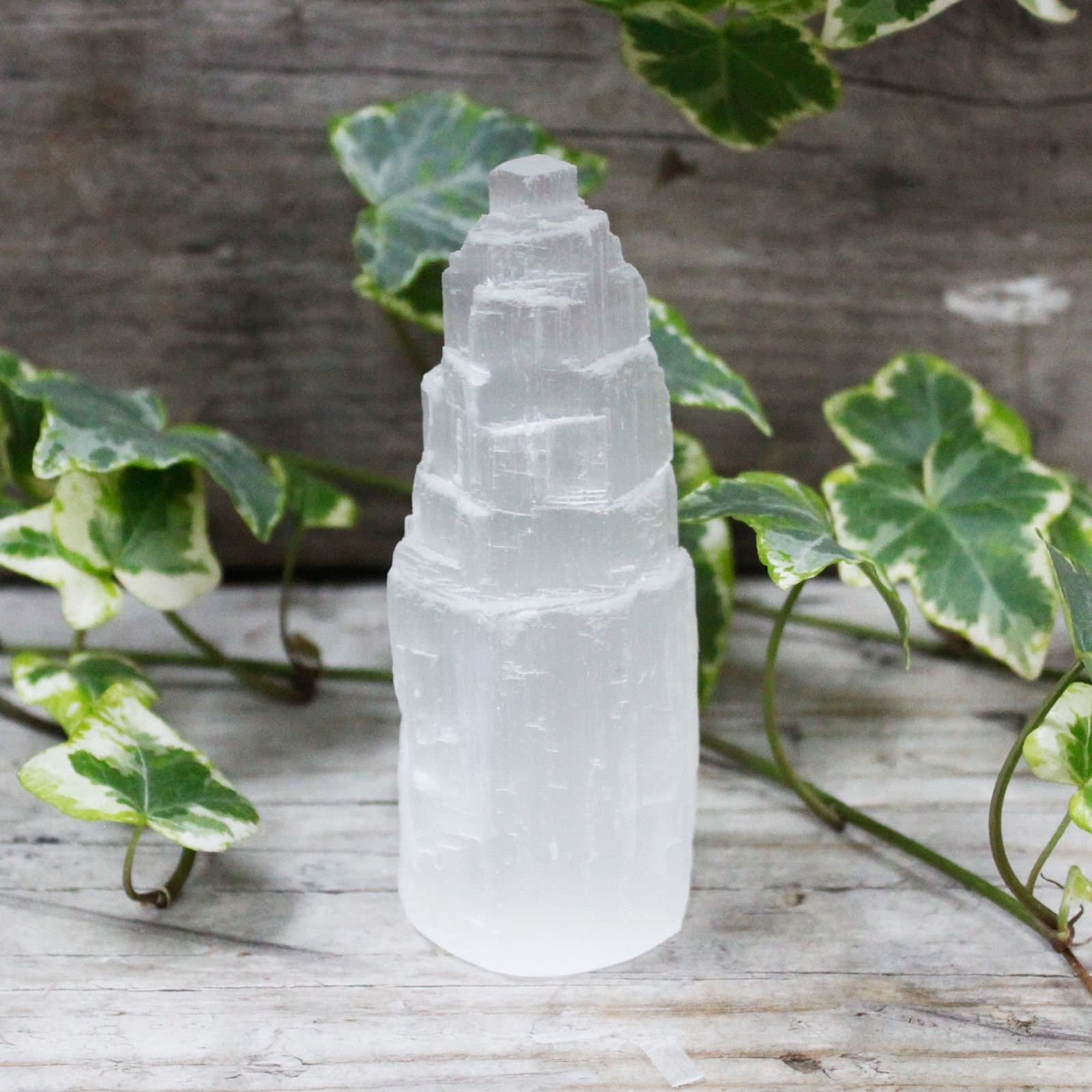 A natural selenite crystal tower with a milky look
