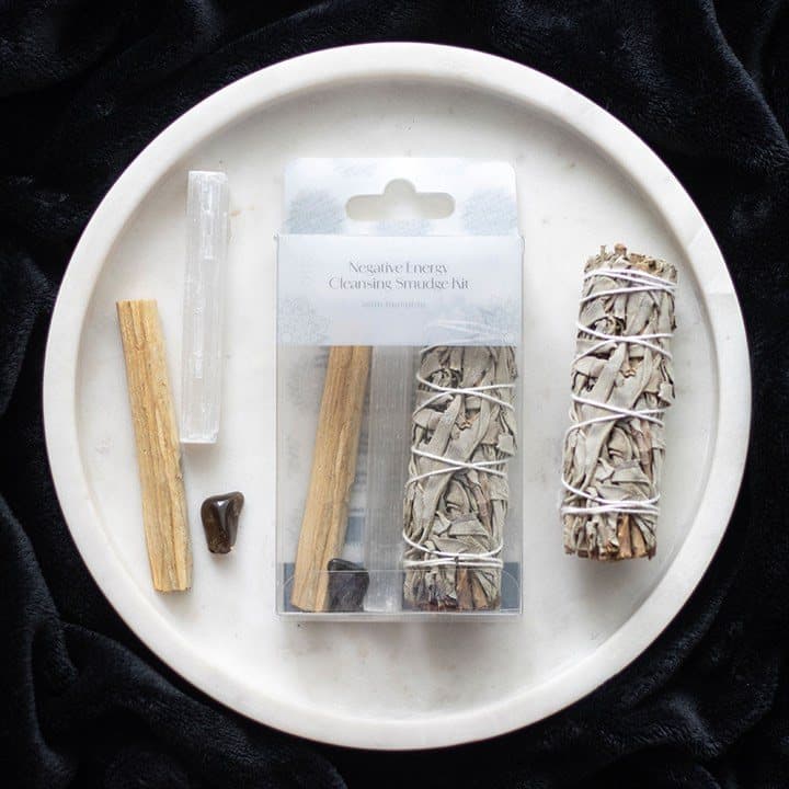 Smudge kit with white sage, Palo Santo, selenite wand and hematite in a window box