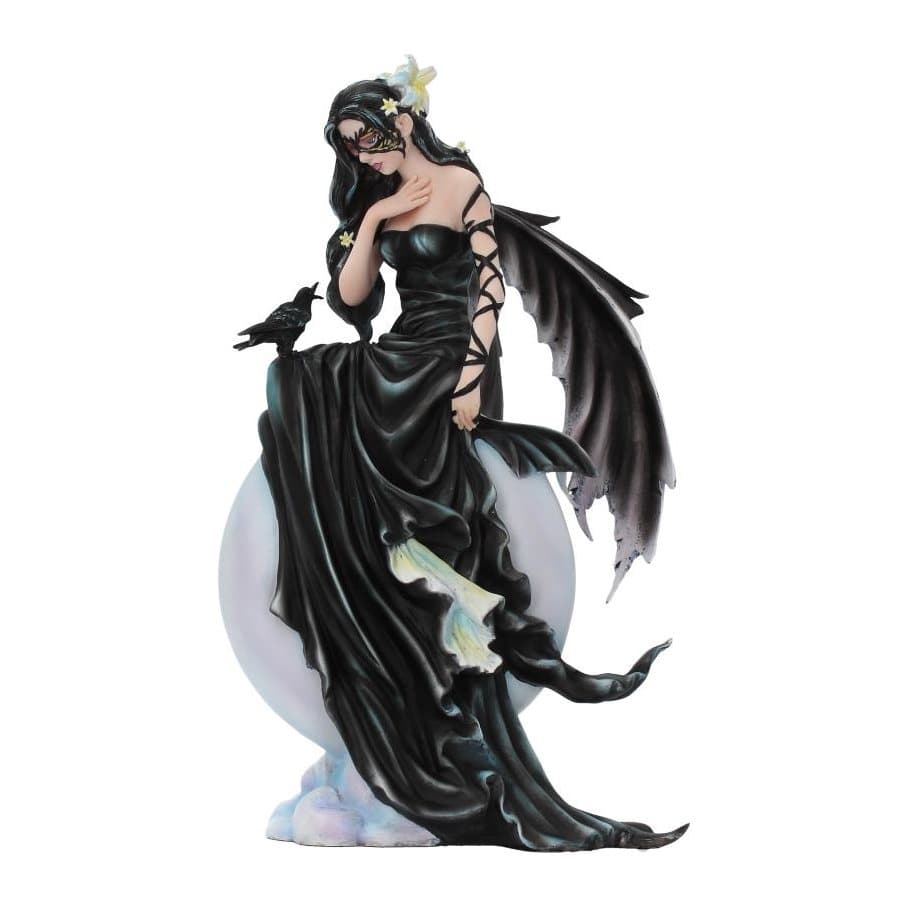 Fairy figurine in black gown sitting on a full moon with a raven