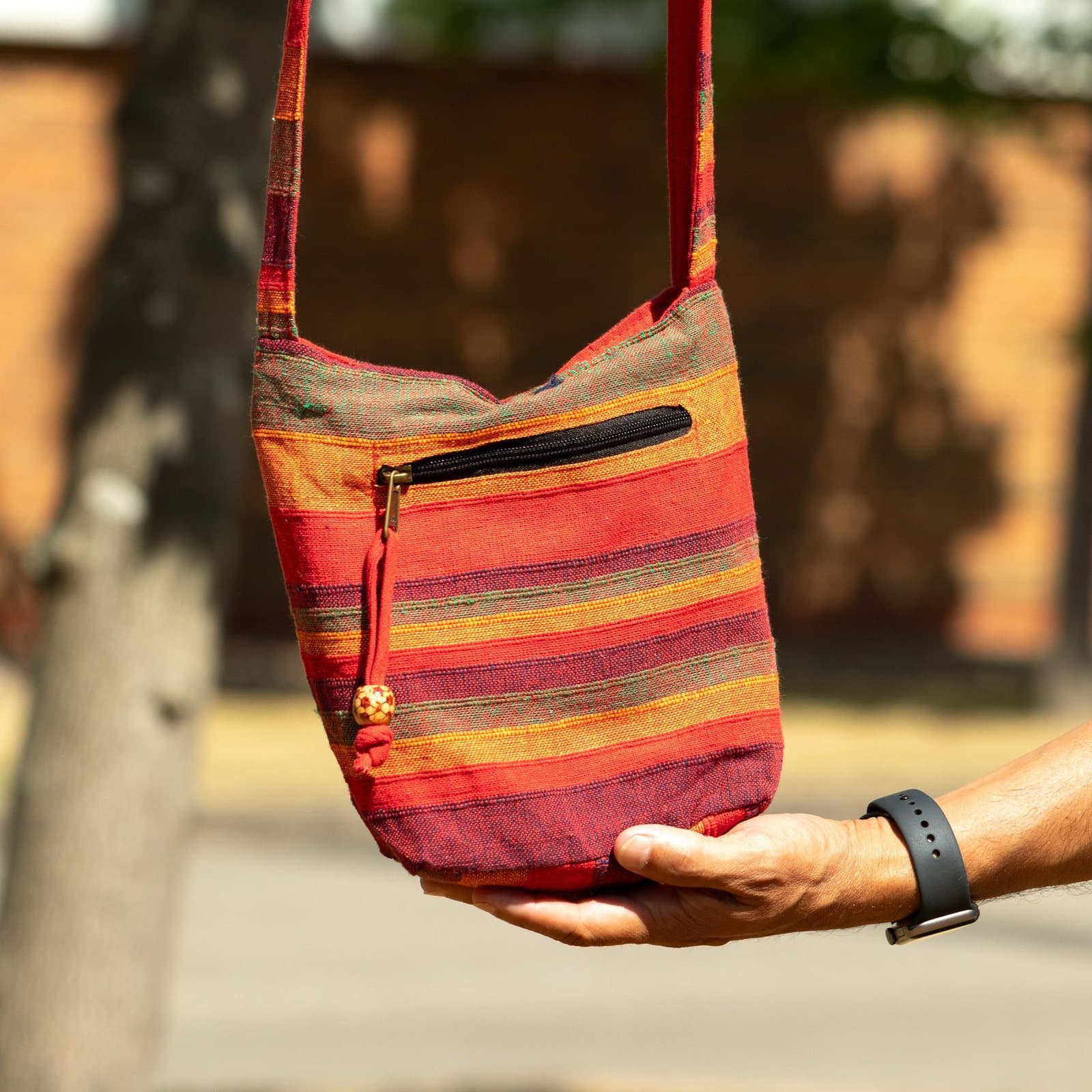 Nepal sling bag in Sunrise Orange