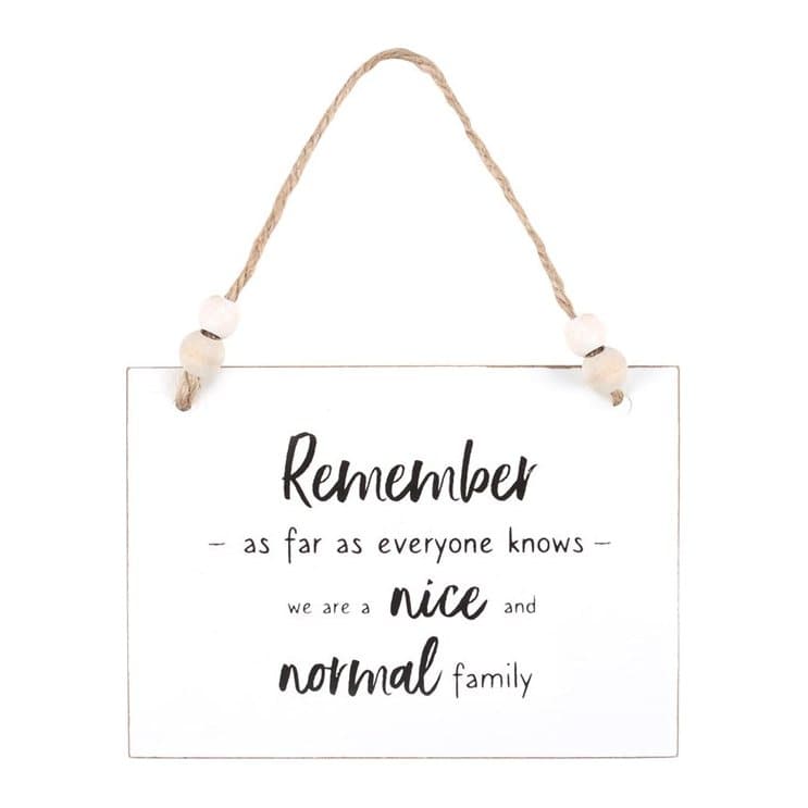 White wooden Nice and Normal Family hanging sign with twine hanger