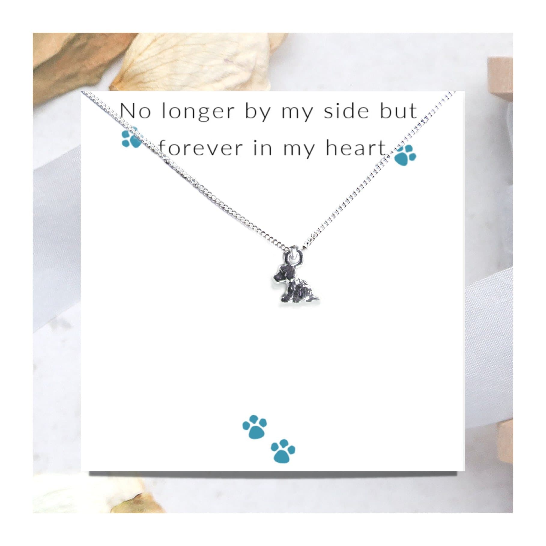 Dog charm necklace on a sterling silver chain, presented on a message card