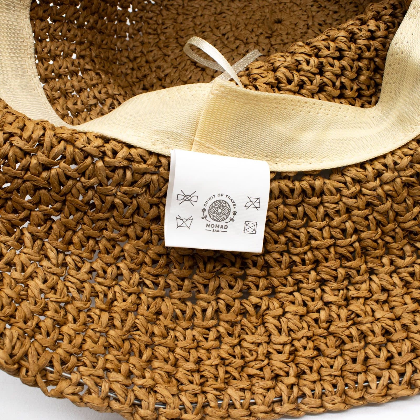 Floppy natural coffee paper straw sun hat with a sloping brim