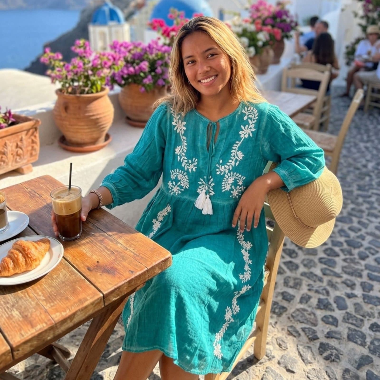 Turquoise summer dress with white floral embroidery and tassel ties