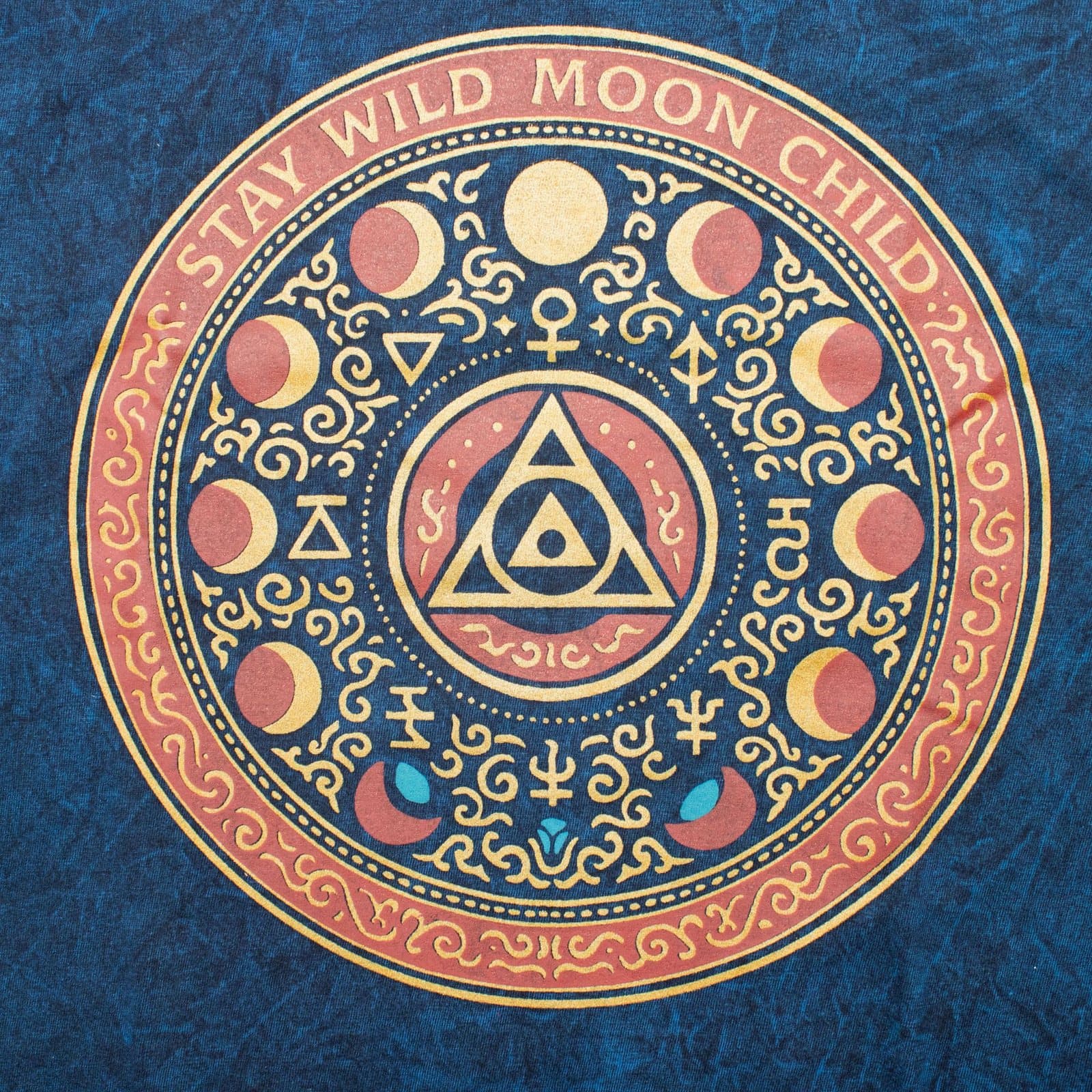 Blue stonewashed cotton t-shirt with a Stay Wild Moon Child design