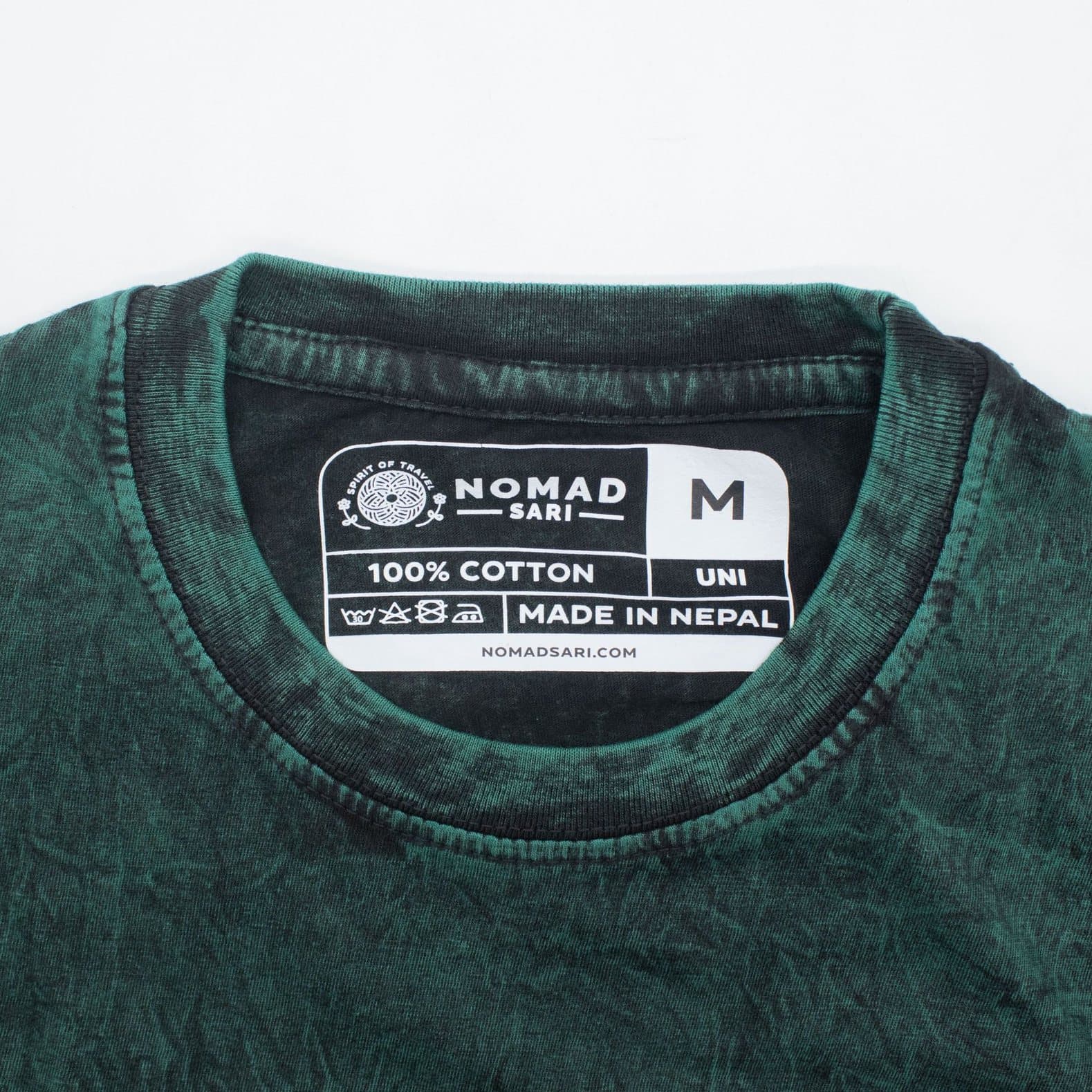 Green stonewashed cotton t-shirt with a Tree of Life design