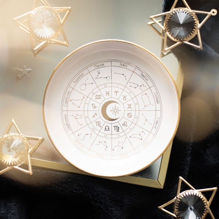 Off-white ceramic trinket dish with a gold effect astrology wheel design