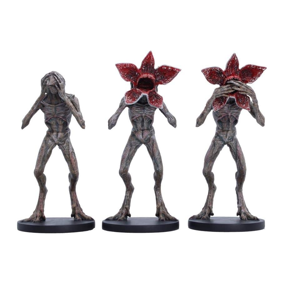 Three hand-painted Demogorgon figurines in a See No Evil, Hear No Evil pose arrangement