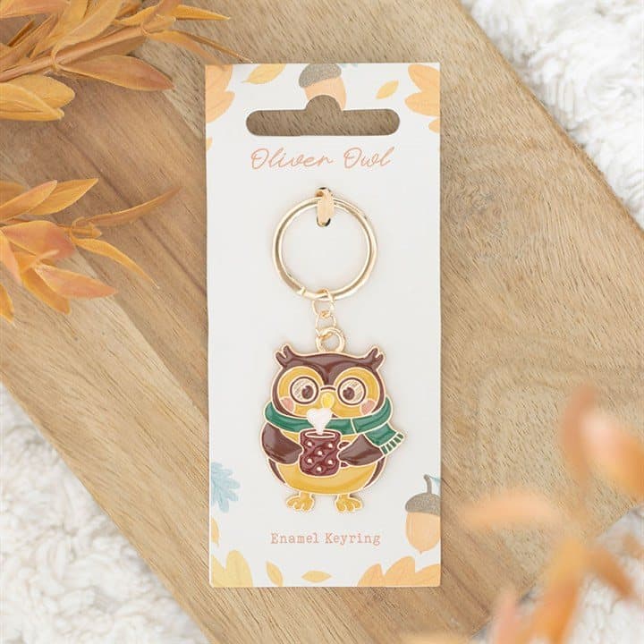 Oliver Owl enamel keyring on a cardboard back