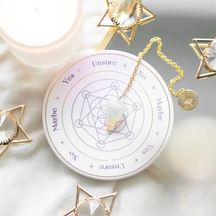 Opalite pendulum and stoneware divination base with a Flower of Life design