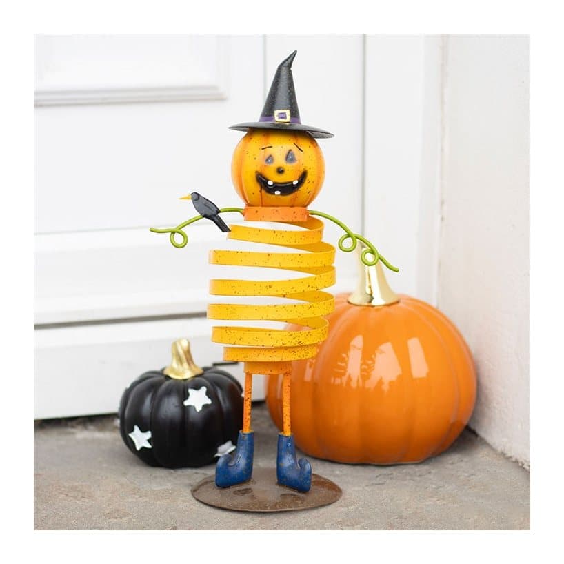 Orange metal pumpkin man with a spring body and witch's hat