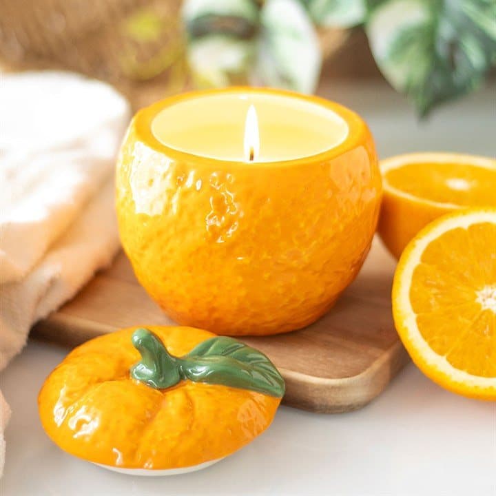 Orange-shaped ceramic candle jar