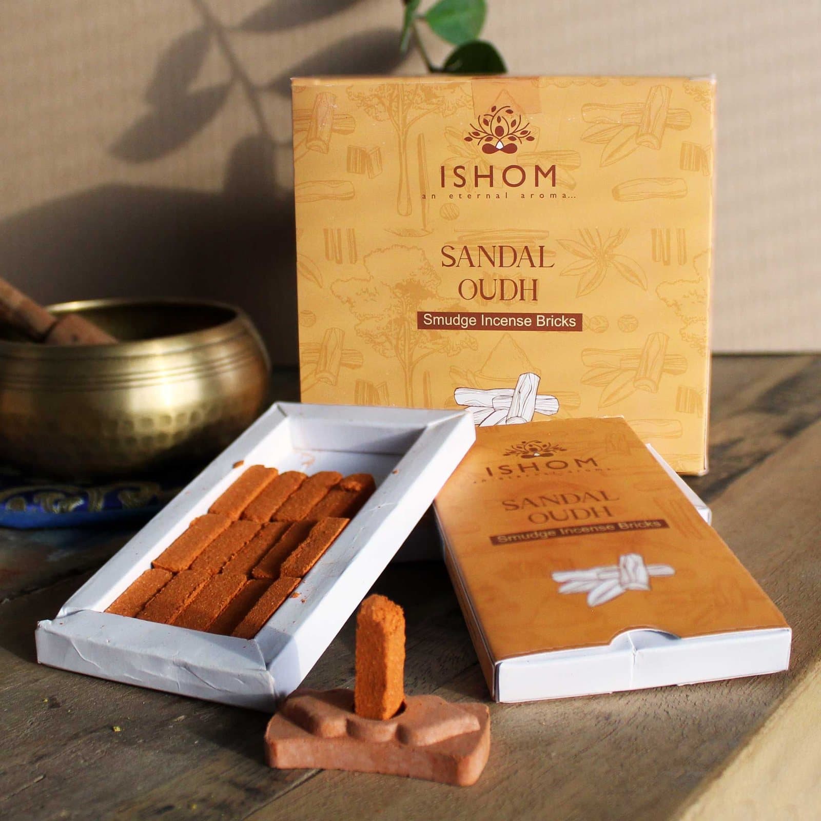 Sandal wood incense bricks with a terracotta holder