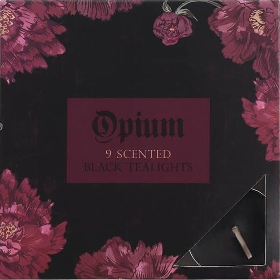 Pack of nine black opium scented tealights in a floral picture box